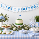 Golf hole in one happy birthday bunting hanging above a golf themed 1st birthday dessert table