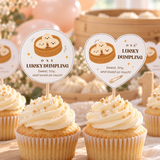 Cupcakes with round and heart little dumpling 1st birthday toppers on a dessert table