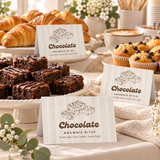 Baby Is Brewing food labels standing in front of brownies, croissants and muffins on a coffee baby shower brunch buffet