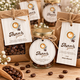 Baby Is Brewing favor tags tied with twine to kraft coffee bean bags and mini coffee jars