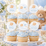 Little Bear cupcake toppers on blue frosted cupcakes on a cake stand at a teddy bear baby shower
