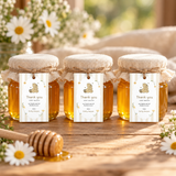 Classic Honey Bear baby shower favor tags tied with jute twine to three small honey jars