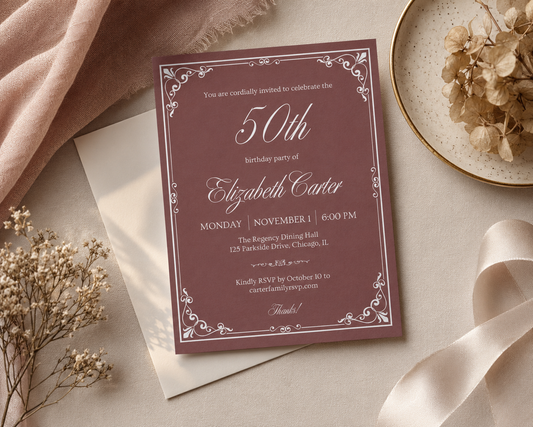 Elegant 50th birthday invitation in burgundy with an ornate white filigree border
