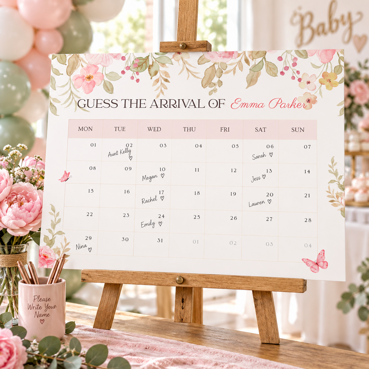 Baby in bloom due date calendar on an easel with guest names written on the dates