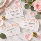 Three baby in bloom food labels on marble with rose petals