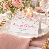 Baby in bloom place card on a plate with a blush napkin and gold cutlery