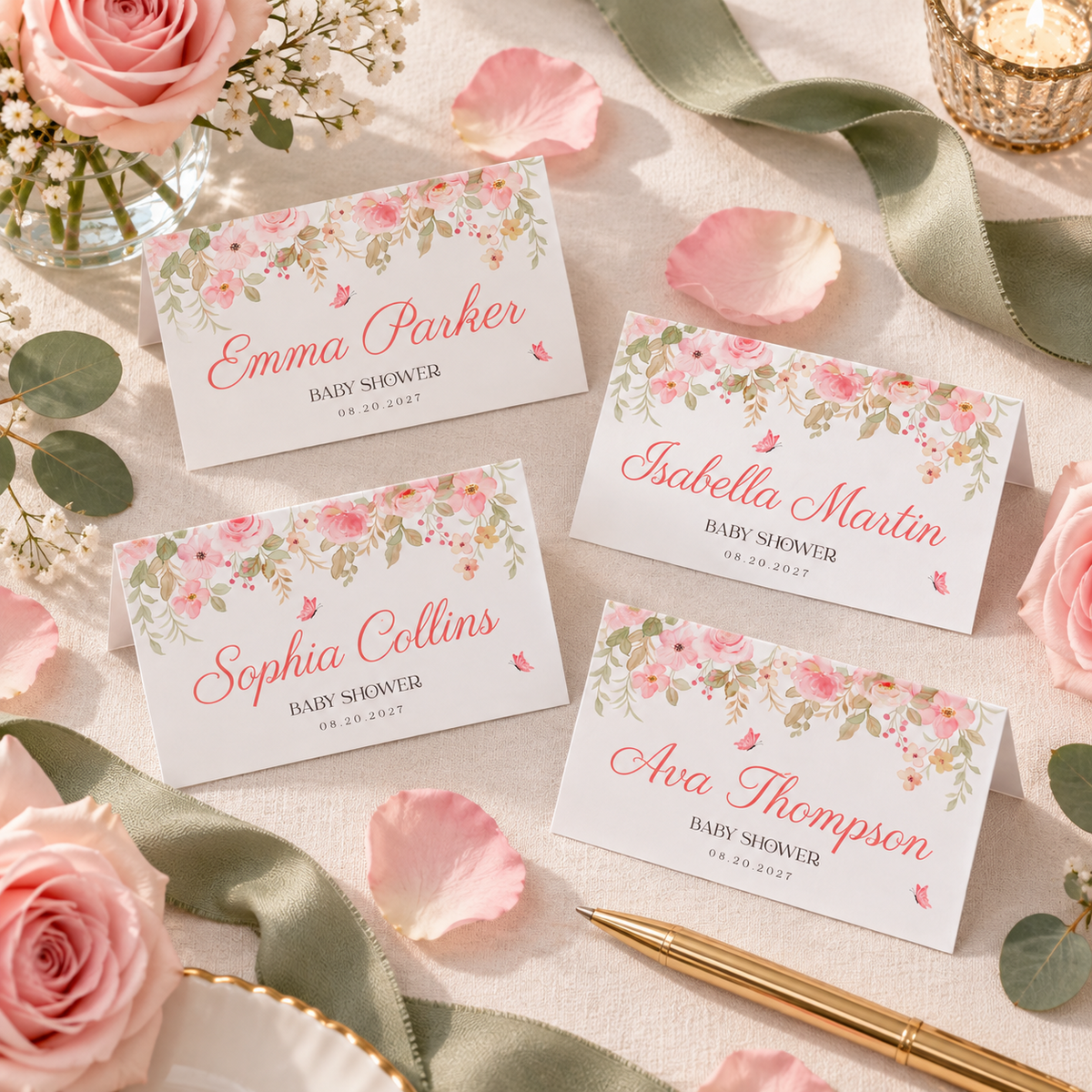 Four baby in bloom place cards with guest names on linen