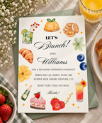 Casual brunch invitation printable template with a painted wreath of pastries, fruit and cocktails