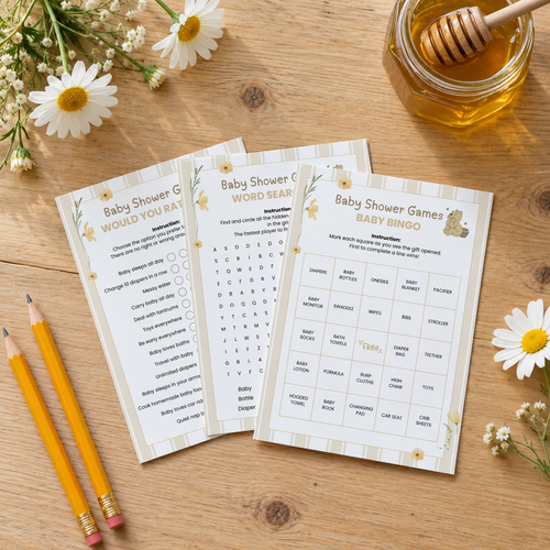 Classic Honey Bear baby shower games printed on cards fanned on a wooden table with honey and daisies