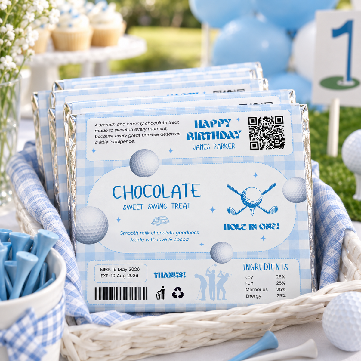 Basket of golf first birthday chocolate bar party favors on an outdoor favor table