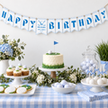 Golf hole in one happy birthday bunting hanging above a golf themed 1st birthday dessert table