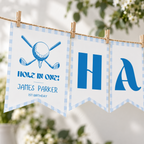 Close-up of the golf title pennant and letter pennants on twine with wooden pegs