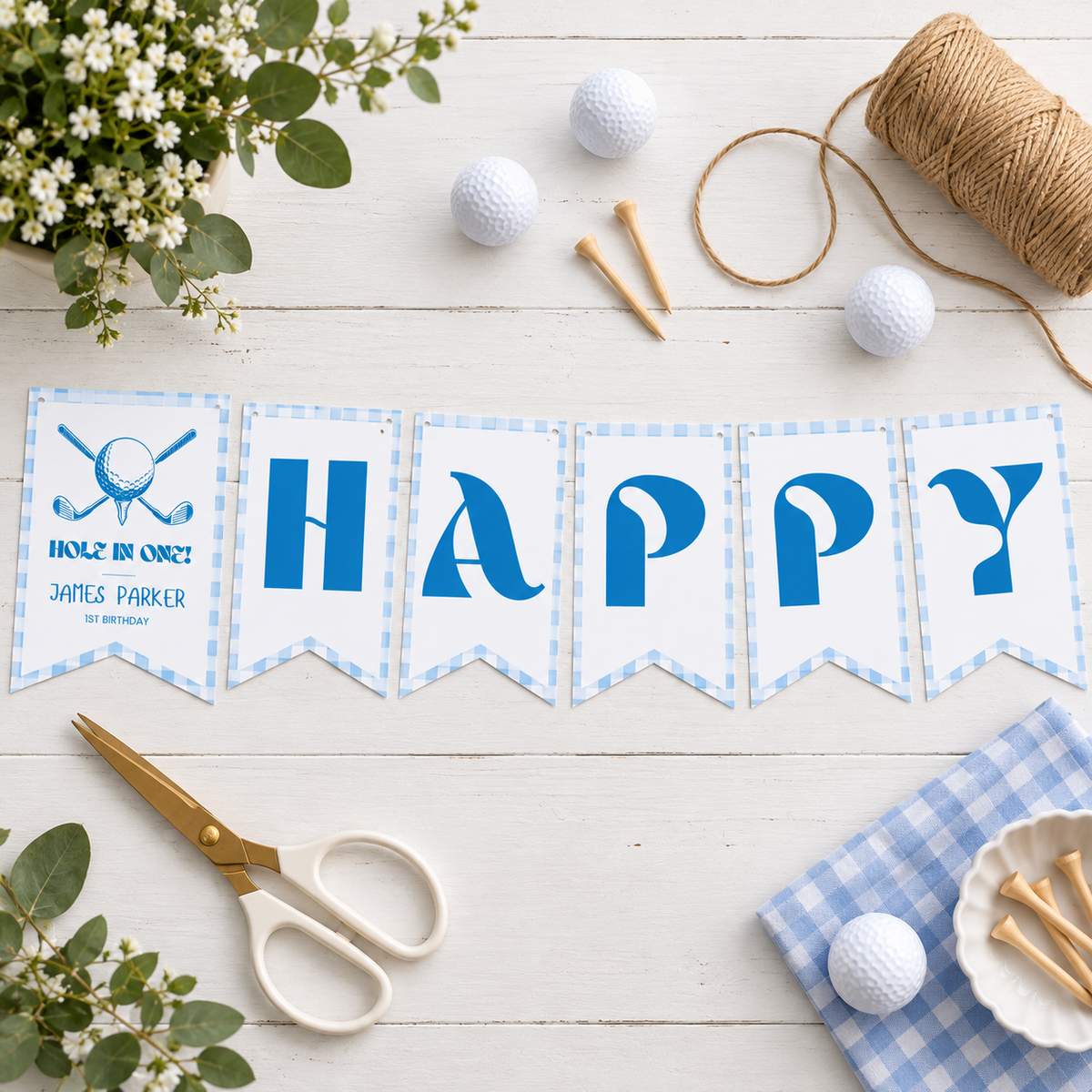 Flat lay of printed golf birthday pennants with scissors, twine and golf balls