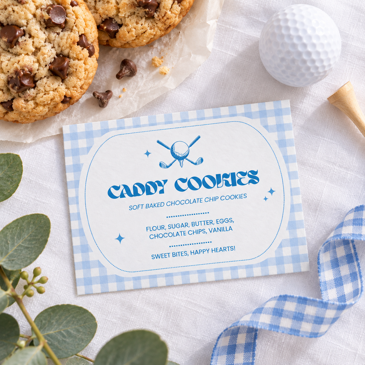 Printed golf first birthday food label flat lay with cookies, golf ball and tee