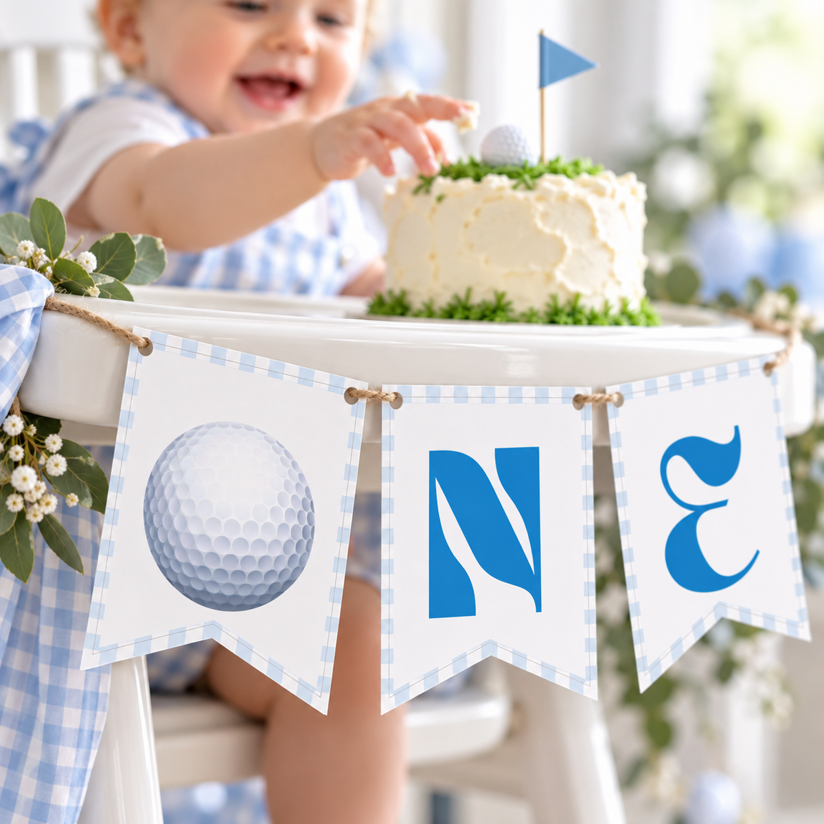 Baby reaching for a golf smash cake behind the ONE high chair banner