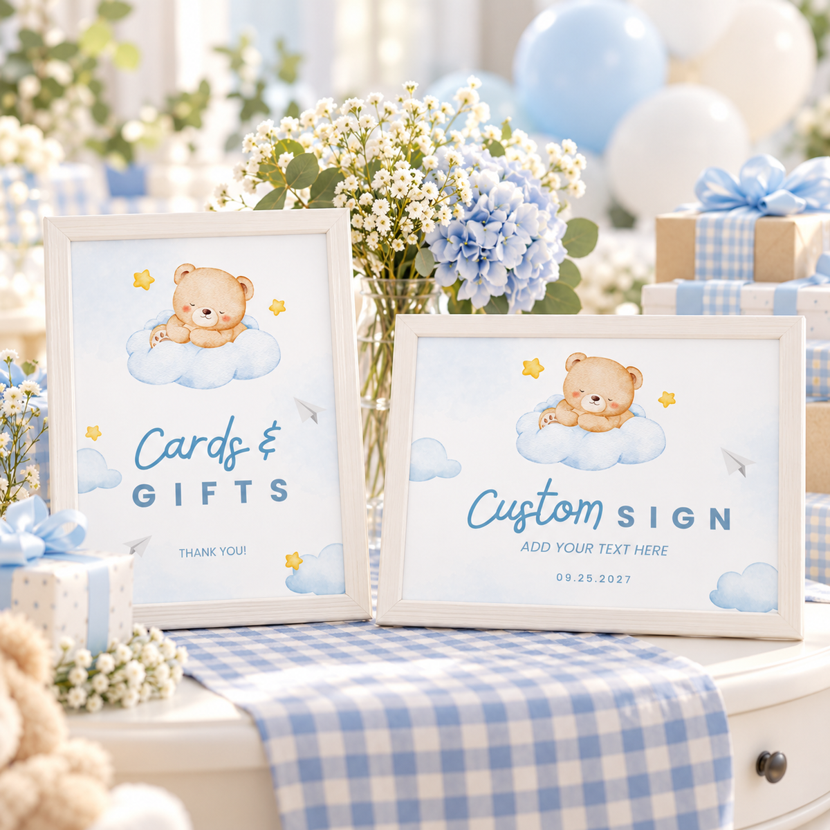 Little Bear Cards and Gifts sign and landscape custom sign on a blue and white baby shower side table