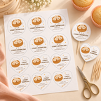 Flat lay of a printed sheet of little dumpling cupcake toppers with scissors and cupcake picks
