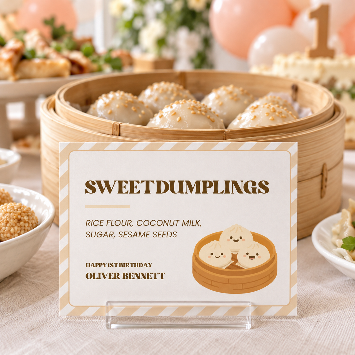 Little dumpling food label in an acrylic stand in front of a steamer of sesame dumplings