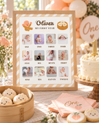 Framed first year milestone board on a 1st birthday dessert table with dumpling cookies and a cake