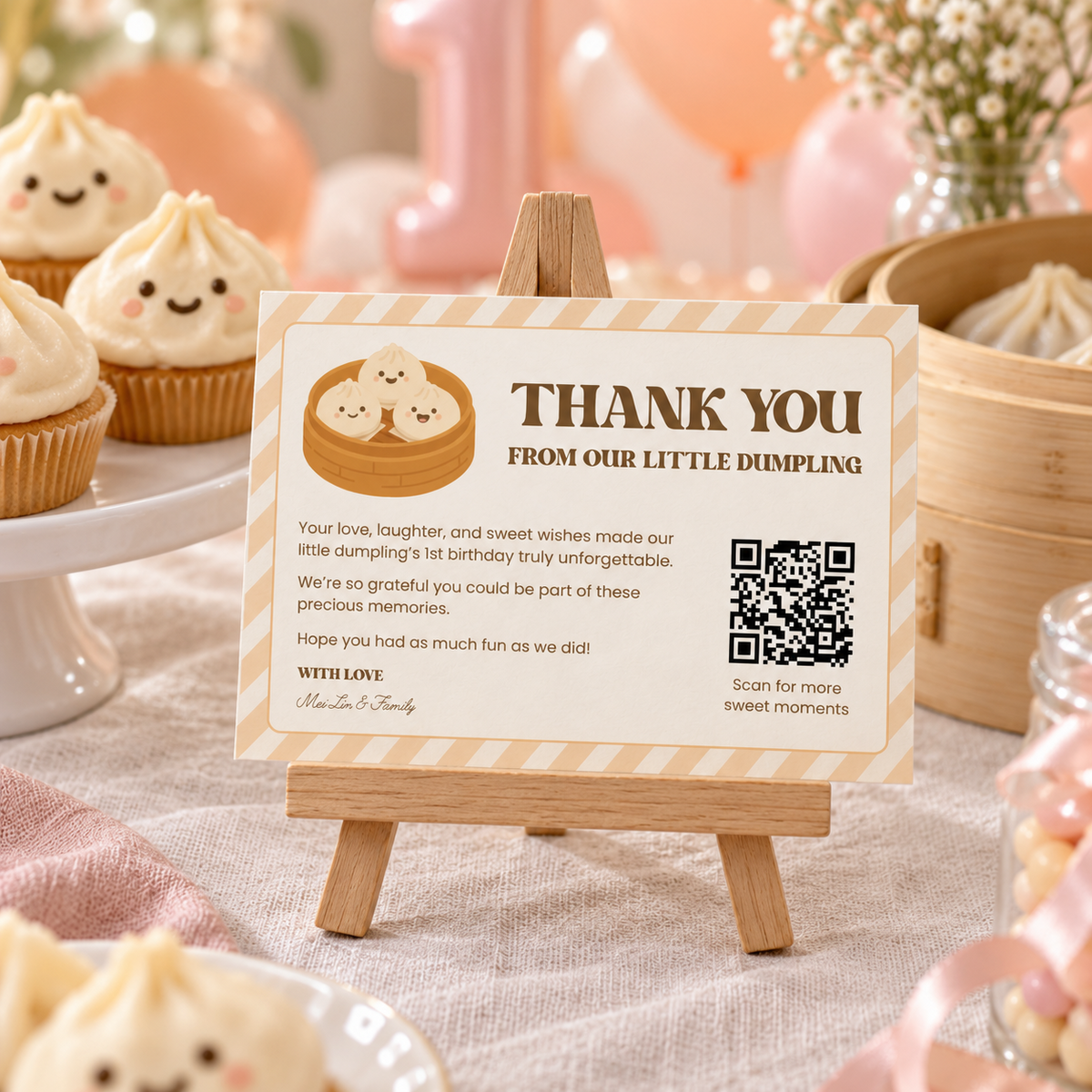 Little dumpling thank you card with QR code on a wooden easel at a 1st birthday dessert table with dumpling cupcakes