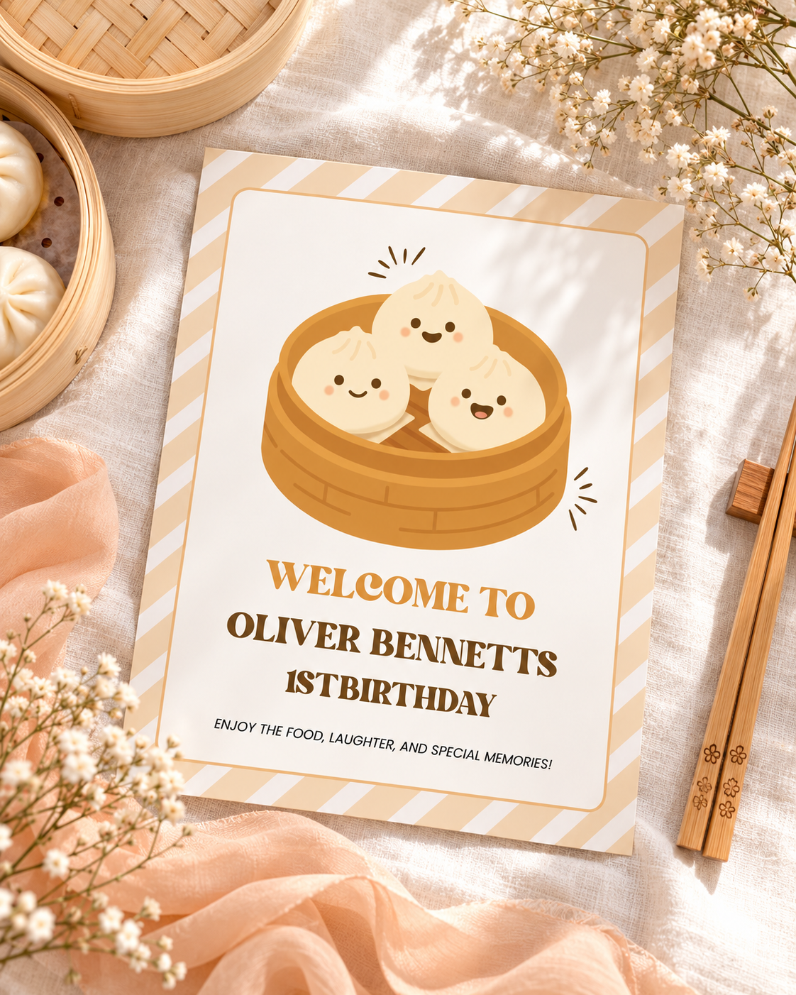 Flat lay of the printable little dumpling 1st birthday welcome sign with chopsticks and a peach ribbon