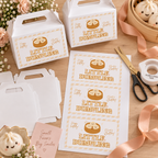 Flat lay of printed little dumpling gable box labels with favor boxes