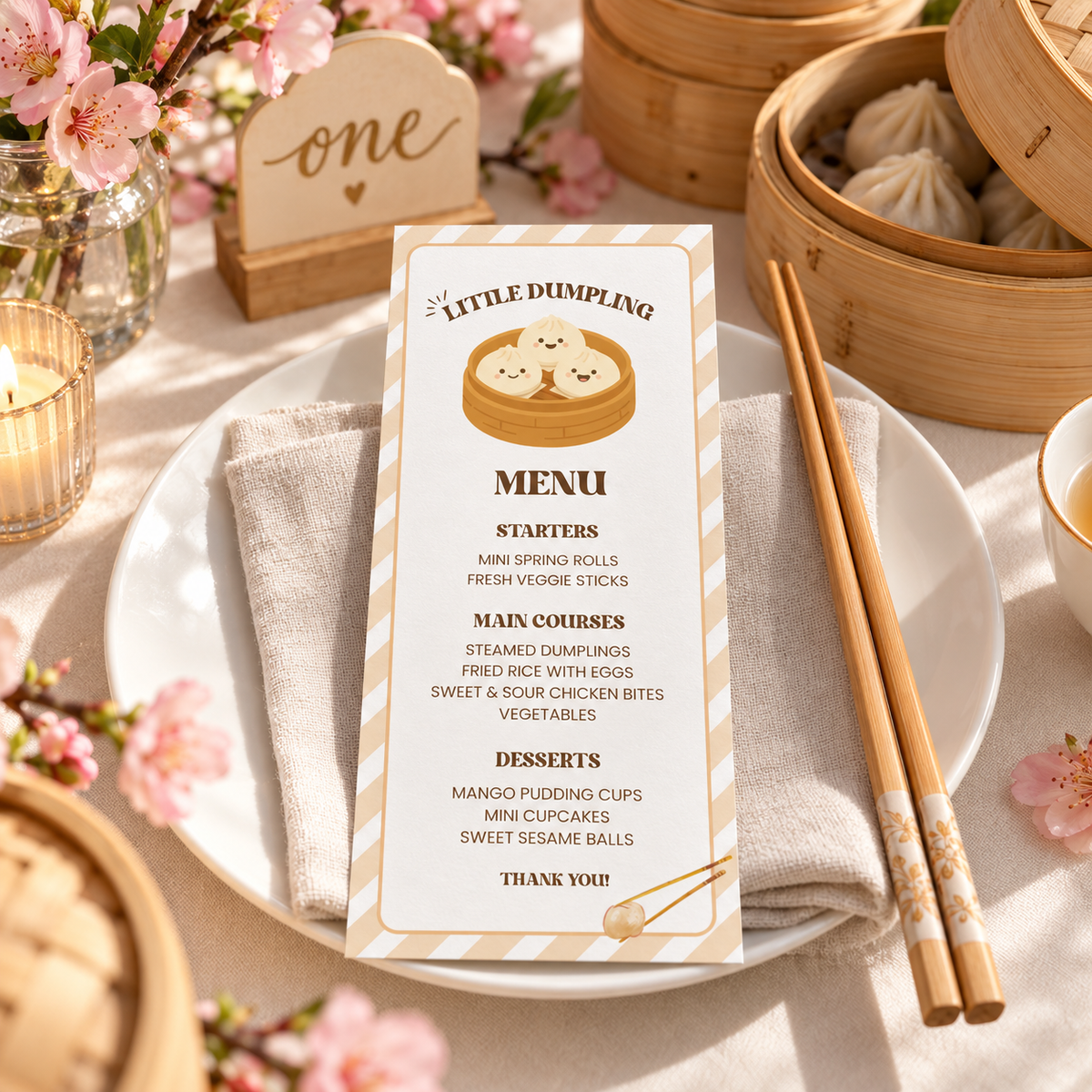 Little dumpling menu card on a plate with chopsticks at a 1st birthday table
