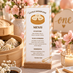 Little dumpling menu card in a wooden stand next to a bamboo steamer