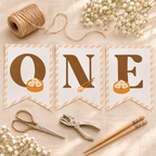Flat lay of the printed little dumpling ONE pennants with twine and scissors