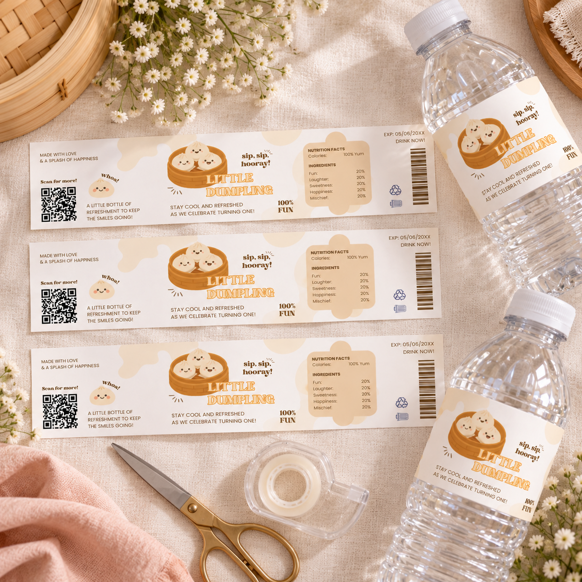 Flat lay of printed little dumpling water bottle labels with scissors and tape