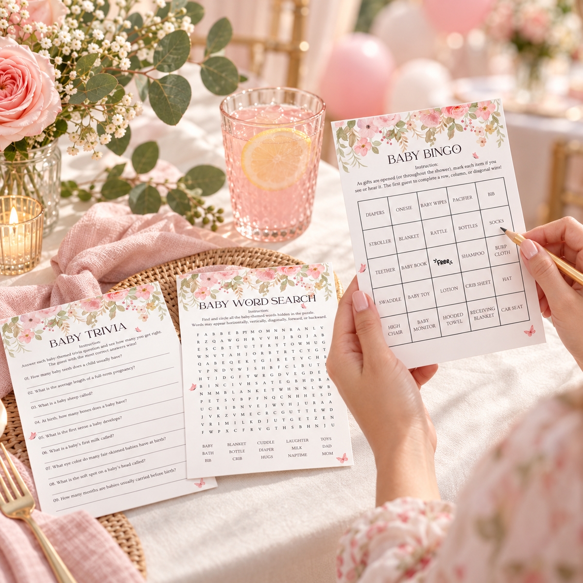 Guest playing pink floral baby shower bingo at a baby shower table