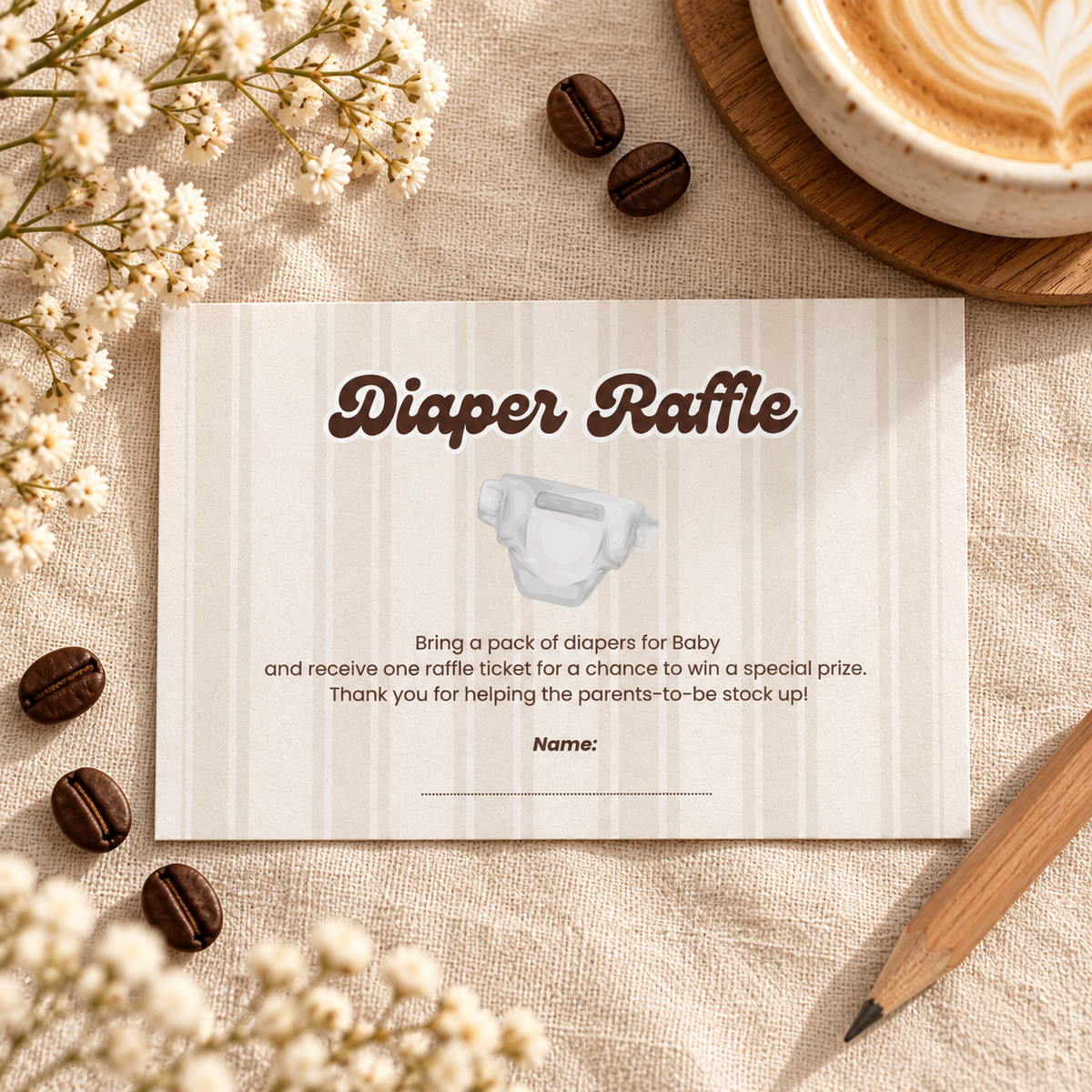 Close-up flat lay of the Baby Is Brewing diaper raffle card with coffee beans and a pencil