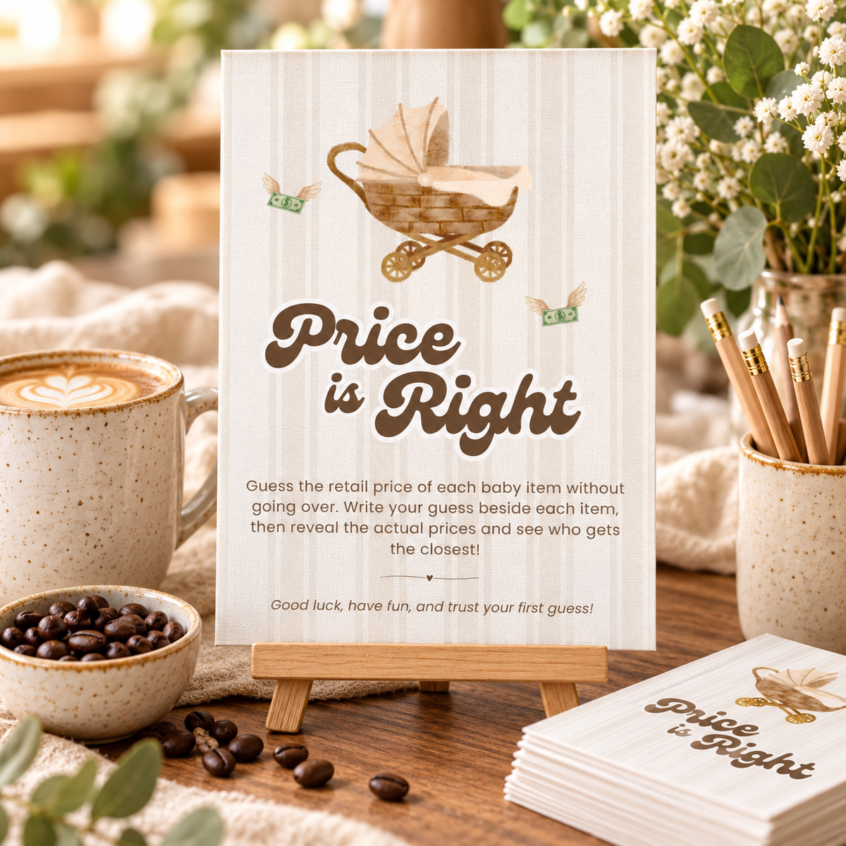 Baby Is Brewing Price Is Right game sign on a small easel next to game cards and pencils