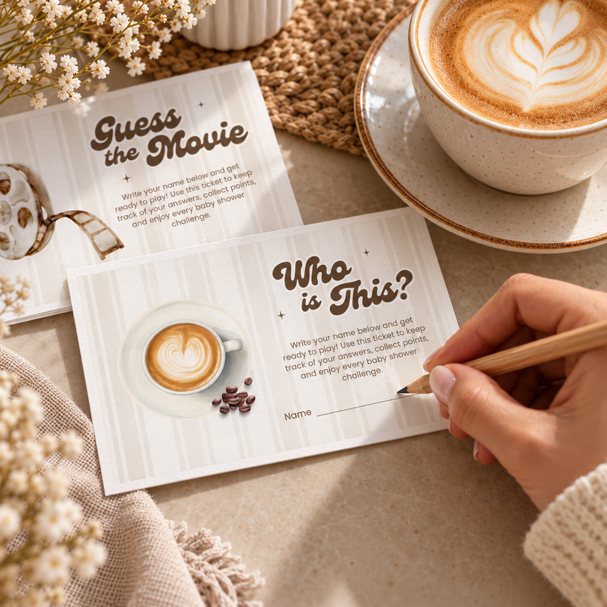 Guest filling in a Who Is This coffee baby shower game ticket next to a latte