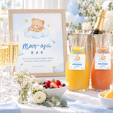 Little Bear Mom-osa bar sign in a frame on a baby shower brunch bar with champagne and juice carafes with tags