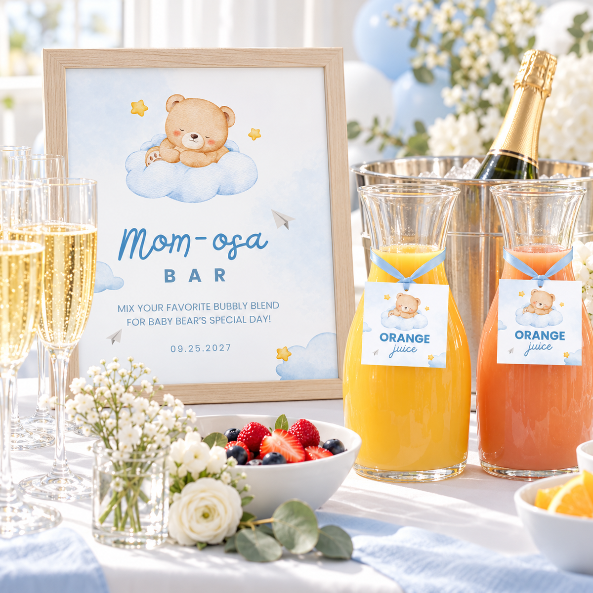 Little Bear Mom-osa bar sign in a frame on a baby shower brunch bar with champagne and juice carafes with tags