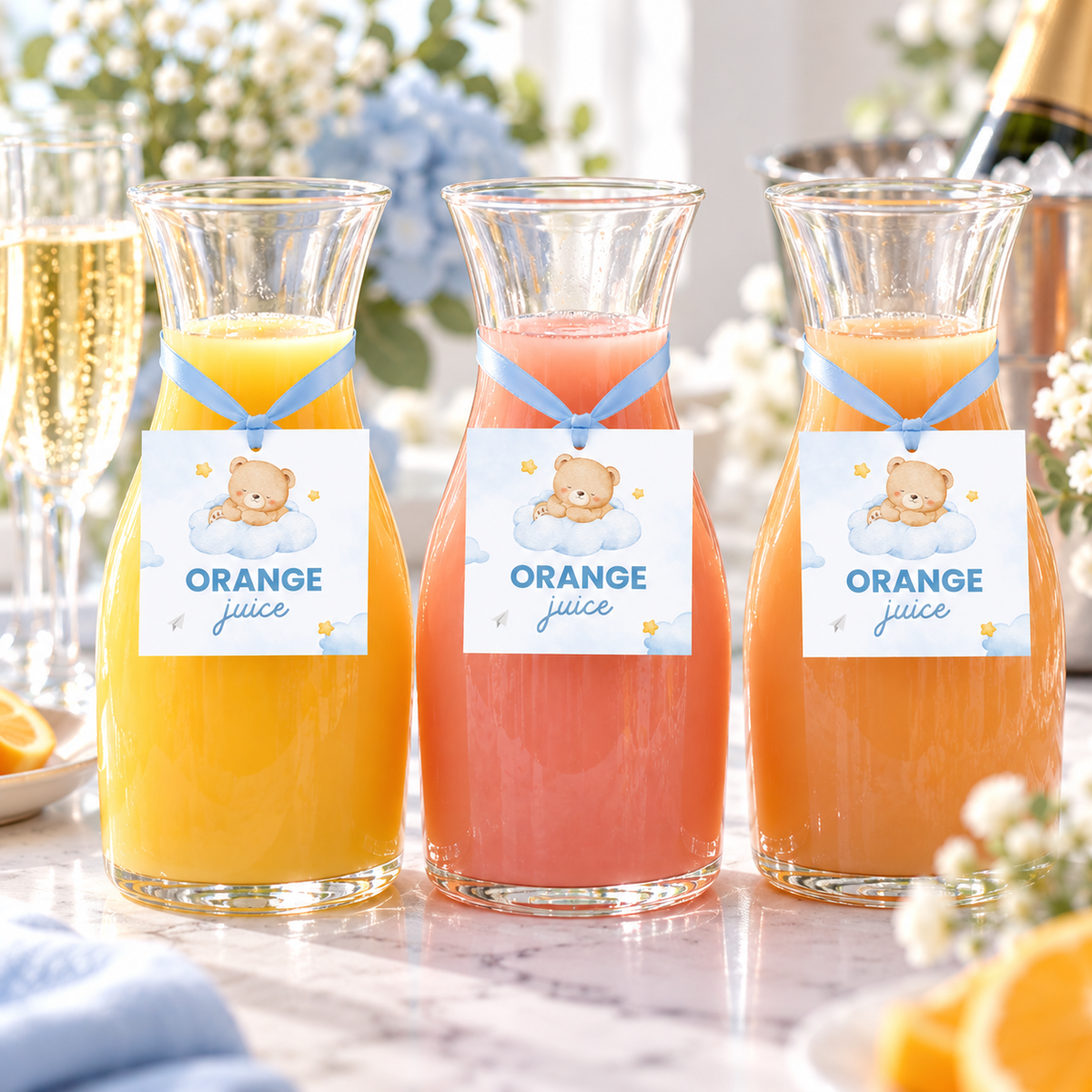 Little Bear teddy bear juice tags hanging on juice carafes with blue ribbon