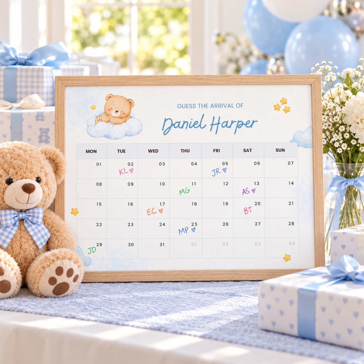 Framed Little Bear due date calendar on a gift table with a teddy bear