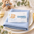 Little Bear teddy bear baby shower place card on a plate with a blue linen napkin
