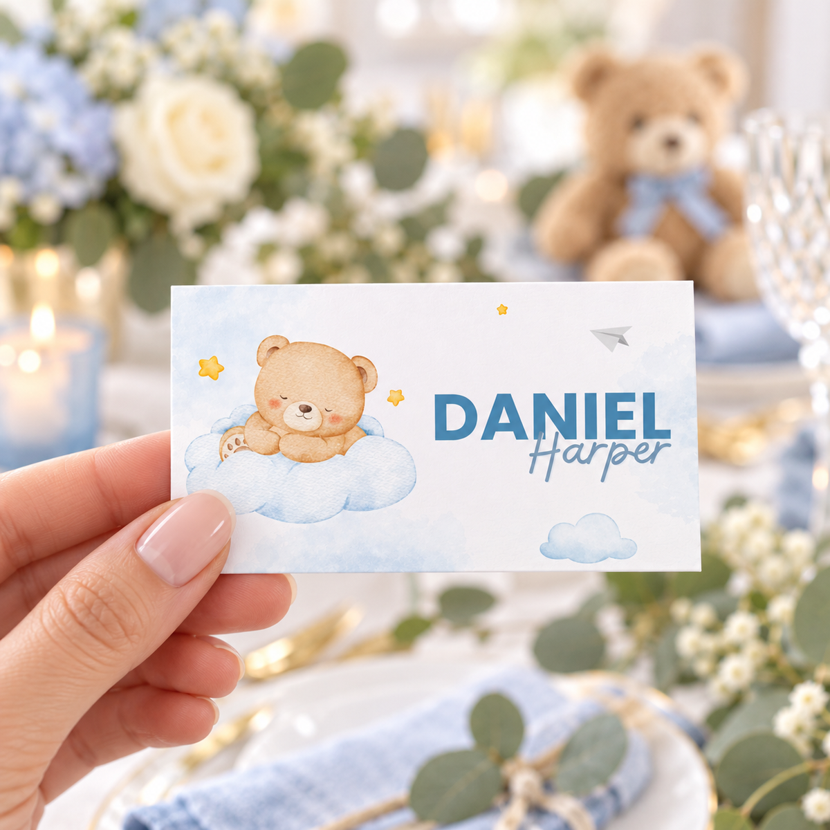 Hand holding a Little Bear blue watercolor teddy bear place card