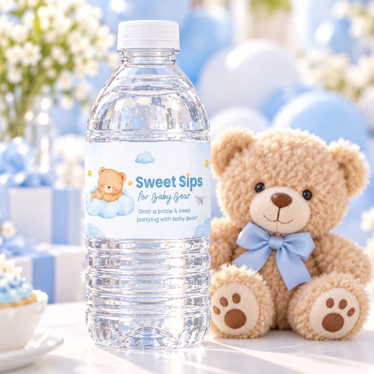 Close-up of a Little Bear water bottle label next to a plush teddy bear