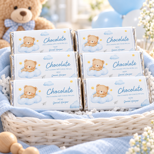Little Bear chocolate bar wrappers as favors in a basket at a teddy bear baby shower
