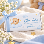Close-up of one Little Bear chocolate bar wrapper tied with a blue ribbon