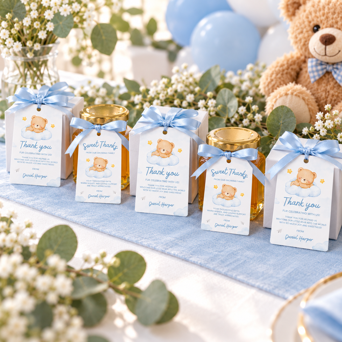Row of baby shower favors with Little Bear thank you tags on a table with a teddy bear