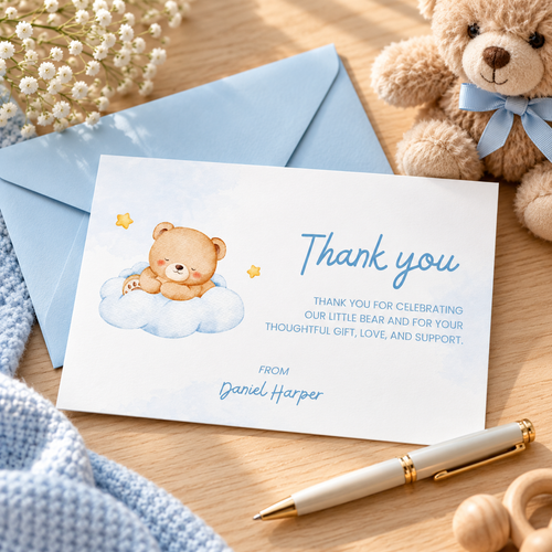 Little Bear baby shower thank you card on a desk with a blue envelope, teddy bear and pen