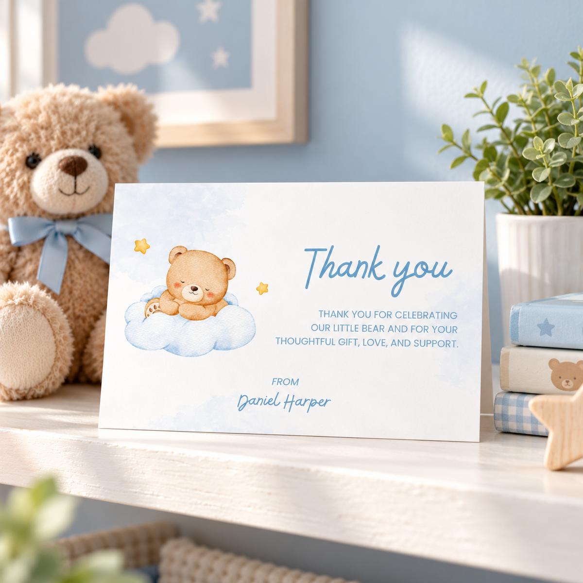 Little Bear thank you card propped on a shelf in a blue nursery with a teddy bear
