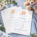 Little Bear baby predictions cards filled in on a blue baby shower table with pens and a teddy bear