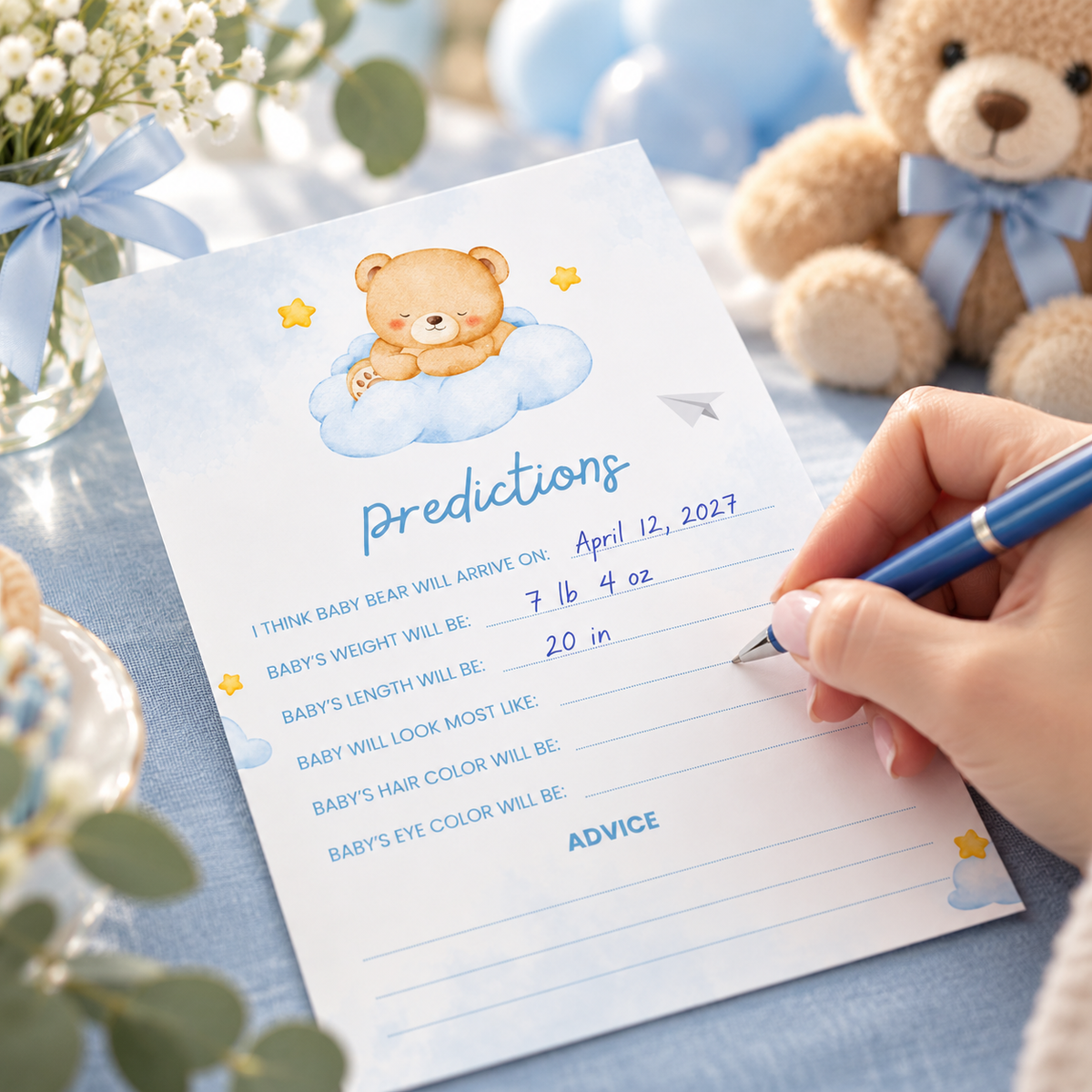 Guest filling in a Little Bear baby predictions card with a blue pen