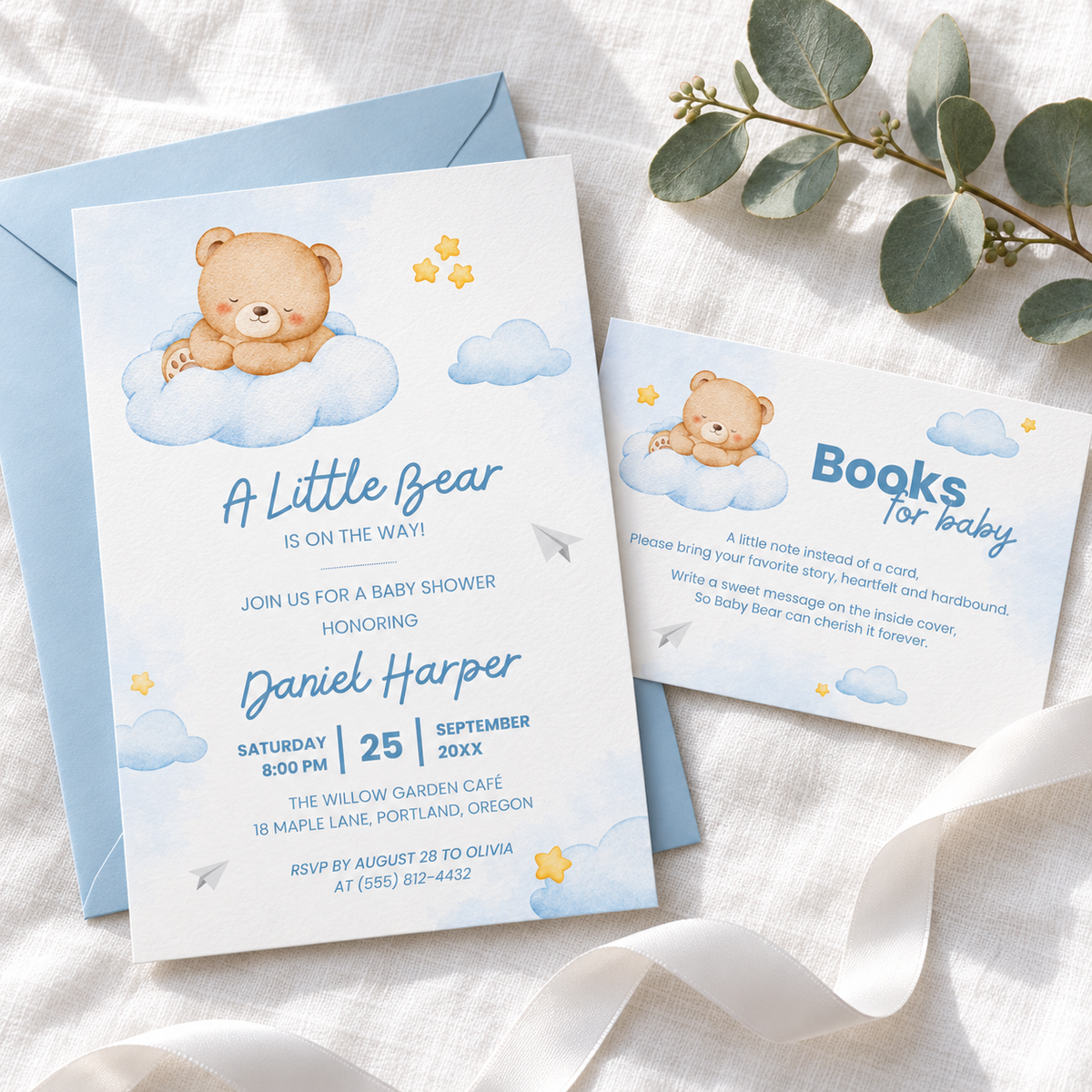 Little Bear books for baby card tucked beside the matching teddy bear baby shower invitation on a blue envelope