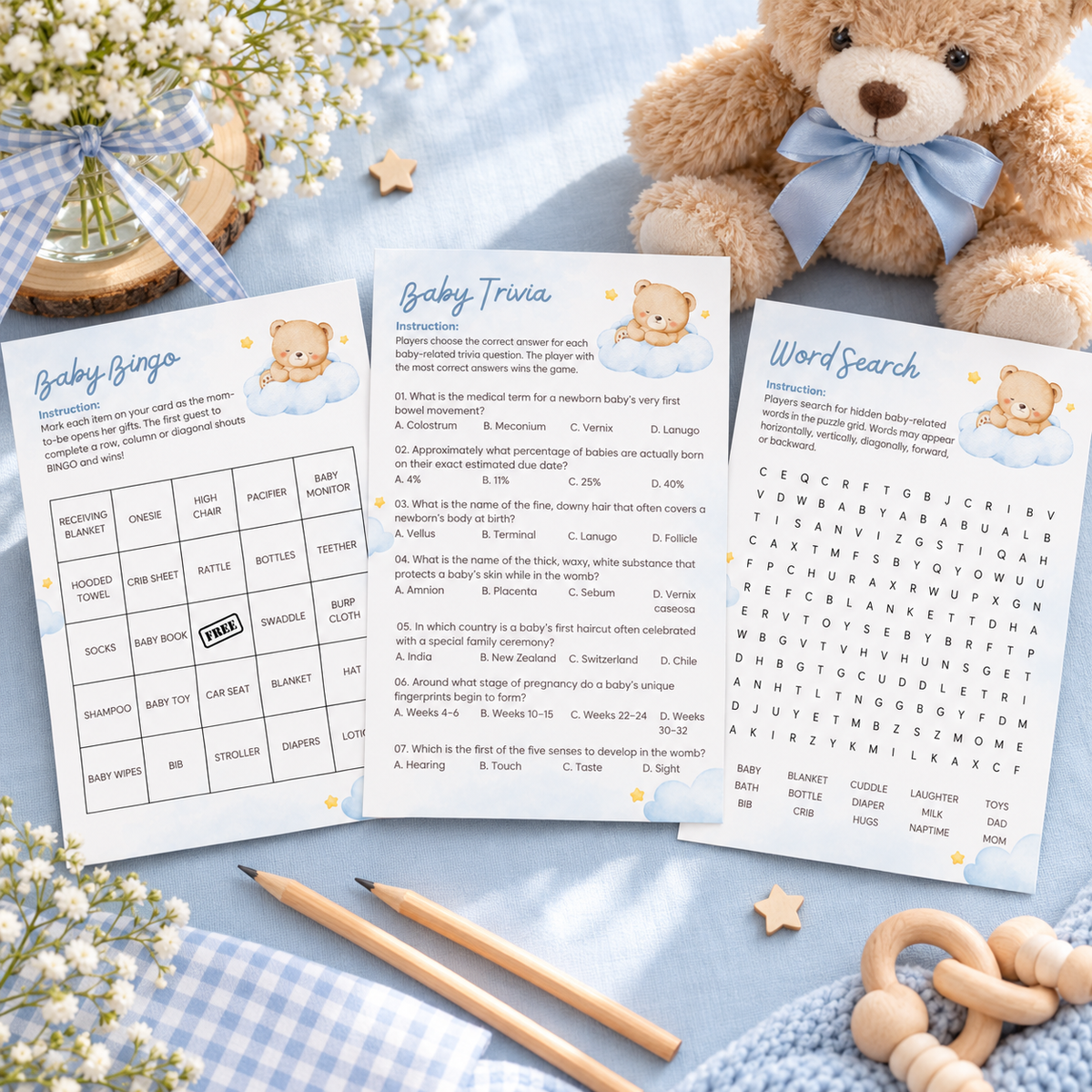 Little Bear baby shower games bundle with bingo, trivia and word search cards on a blue table with a teddy bear
